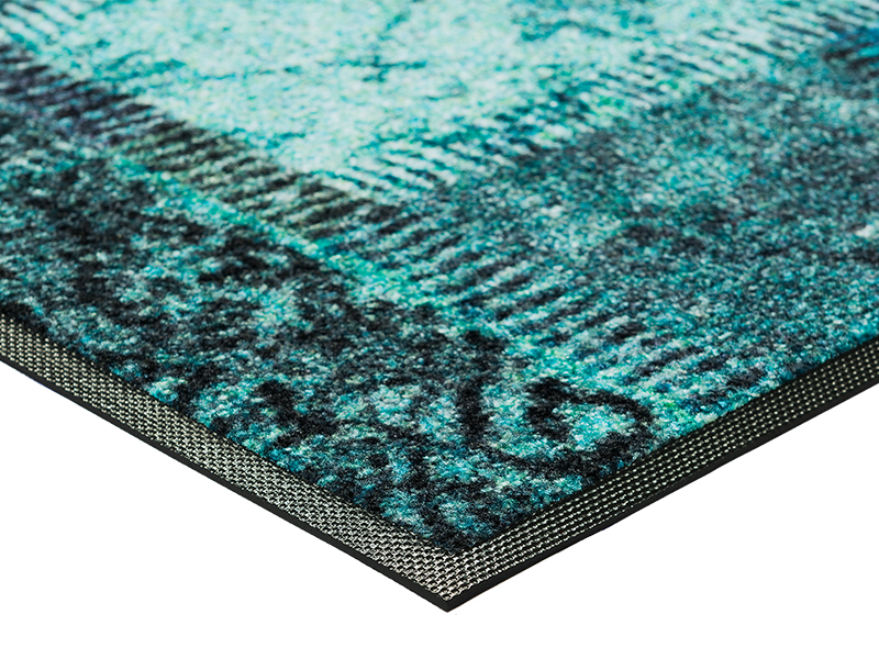 Eckansicht der Fußmatte mit türkisen Farbflächen